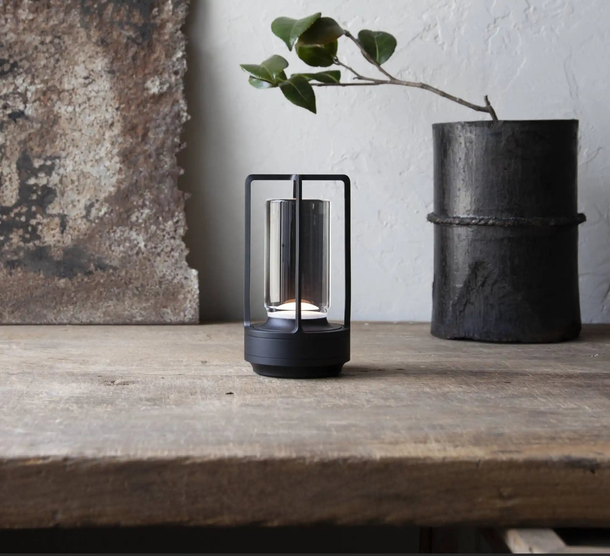 modern-black-portable-lantern-clear-glass-cylinder-light-source.webp